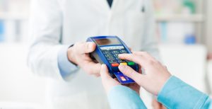 pharmacist charging credit card using merchant services